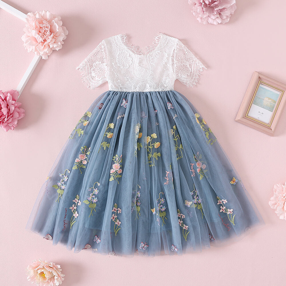 A beautiful lace and tulle flower girl dress in dusty blue rear view