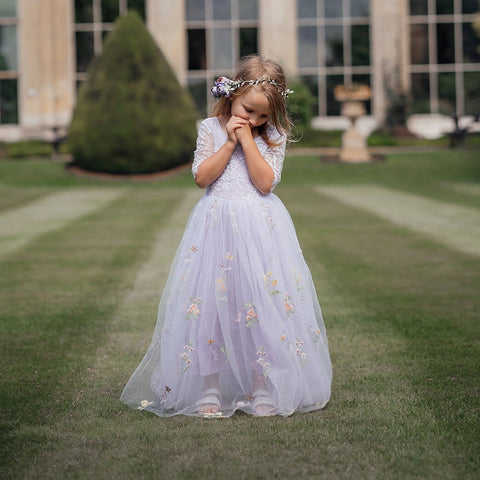 Flower girl wearing the Lilac Enchanted Flower Girl Dress