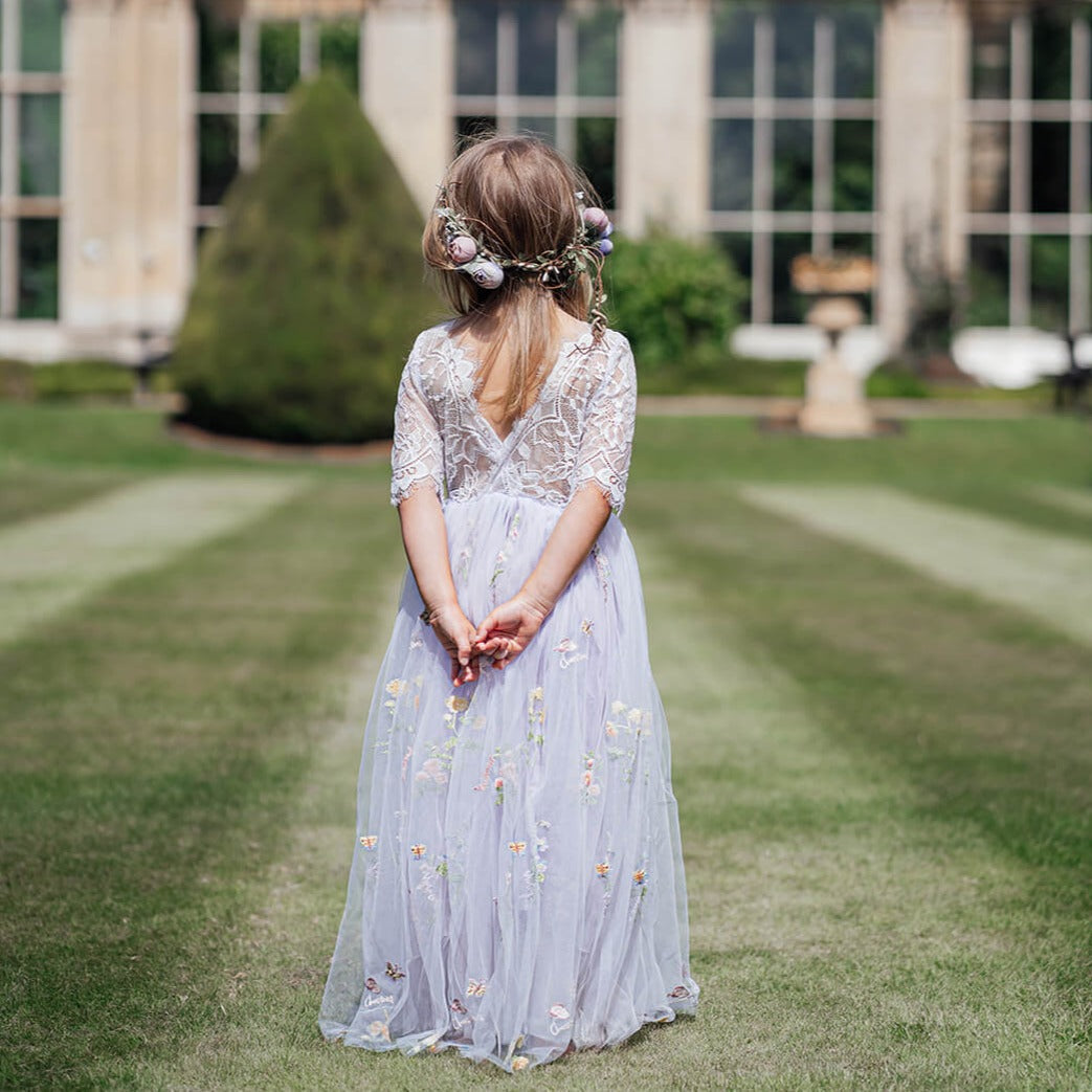 Pretty flower girl in wedding grounds