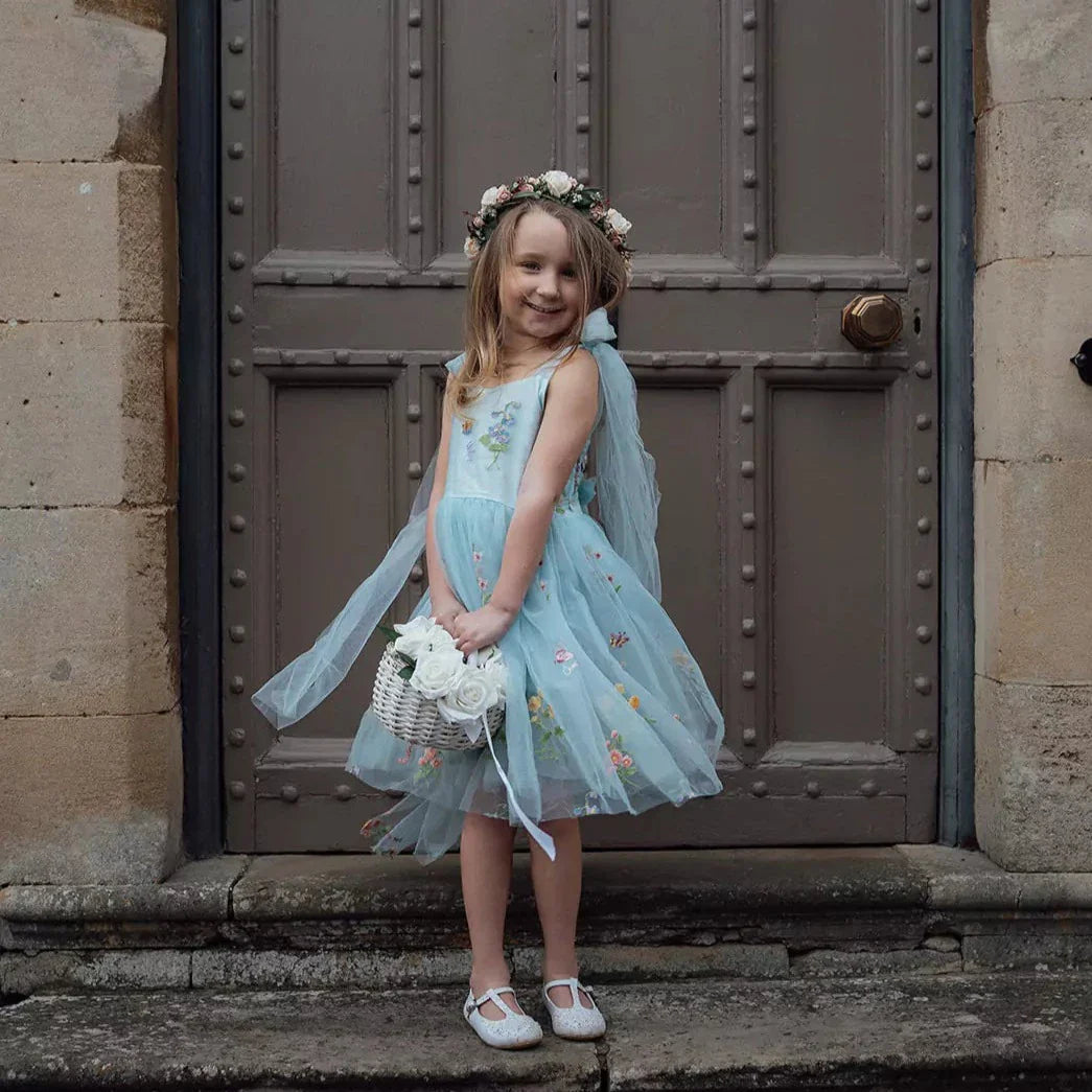 young flower girl in church doorway