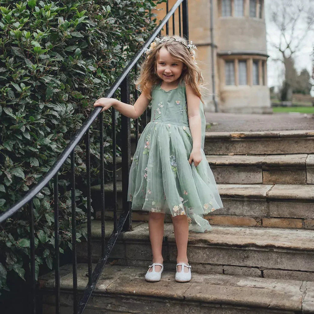 flower girl stood on steps