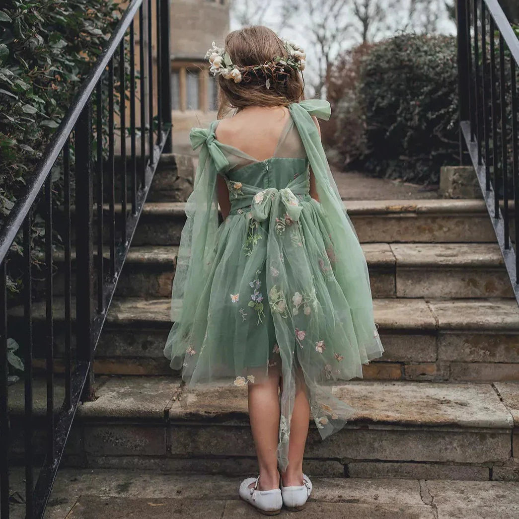 flower girl walking up steps