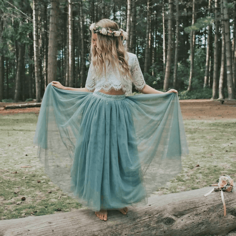 Flower girl playing with dress