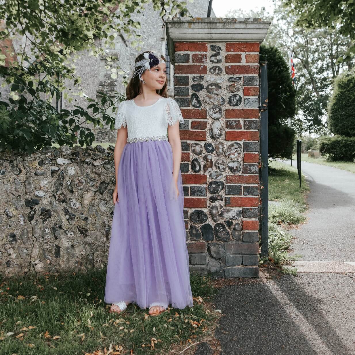 young flower girl waiting at church